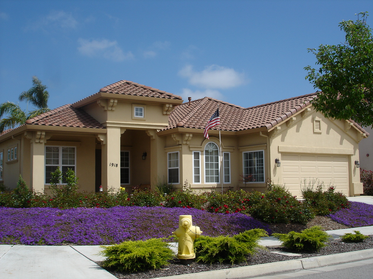 The front of a suburban ranch home is shown.